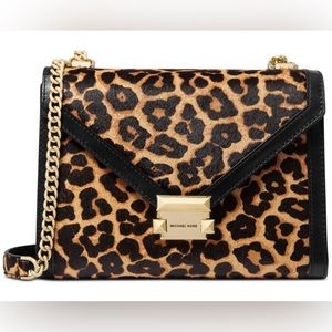 Michael Kors Handbag, New with tags, has hair calf and Leather.